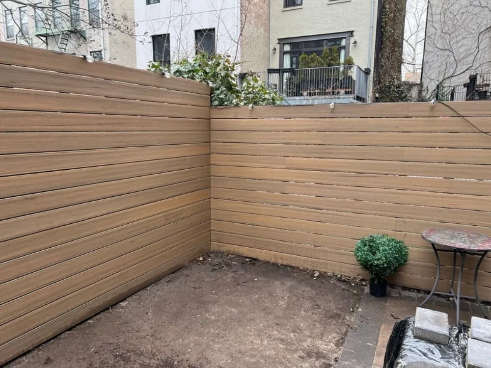 Detail of horizontal slats in Modern Backyard Fence Renovation project.